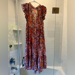 Beautiful dress. Roomy enough for maternity